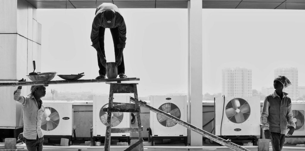 grayscale photography of group of person indoor